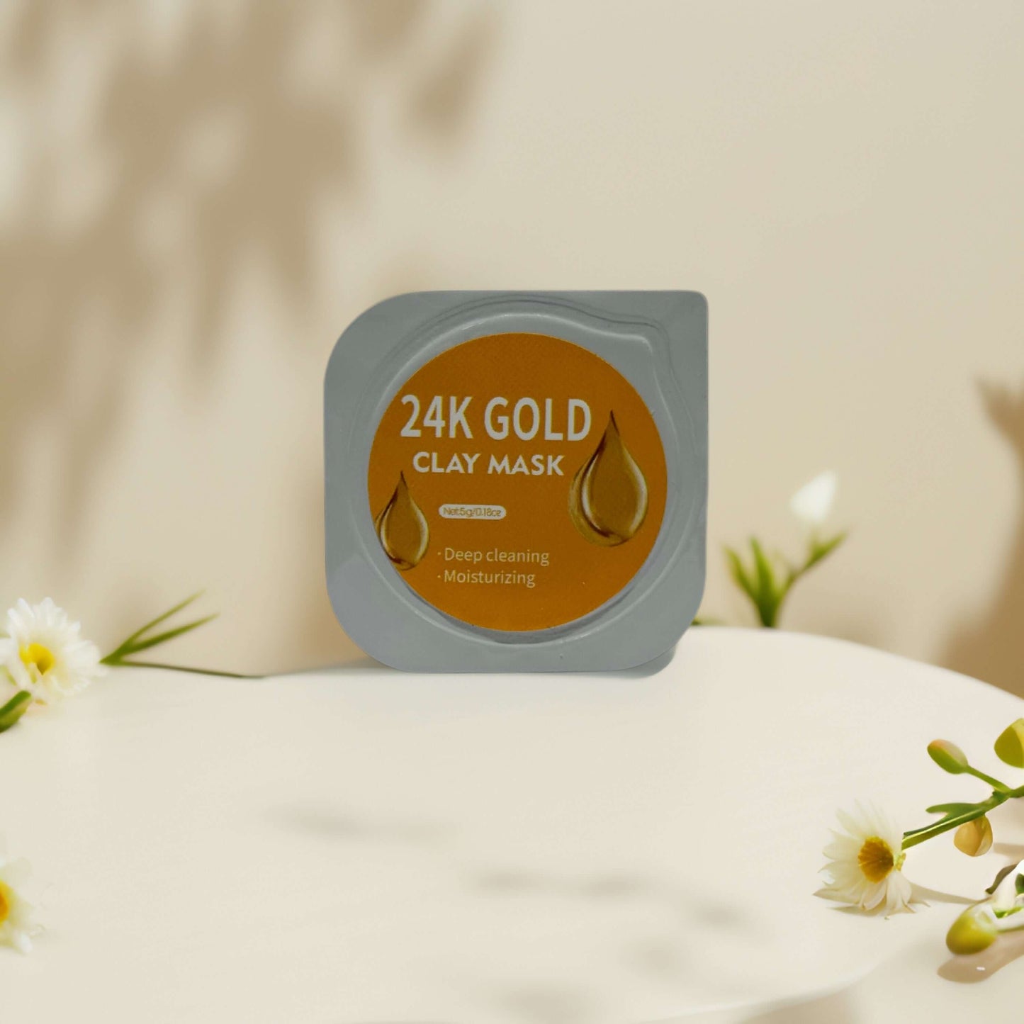 24K Gold Clay Mask pod showcasing deep cleansing and moisturizing benefits against a soft, neutral background.