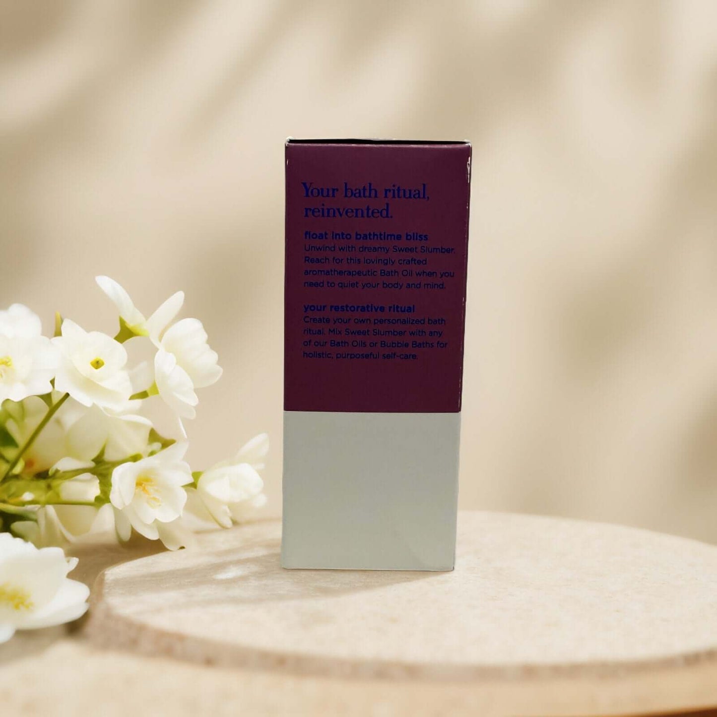 Chamomile lavender bath oil packaging with floral accents.