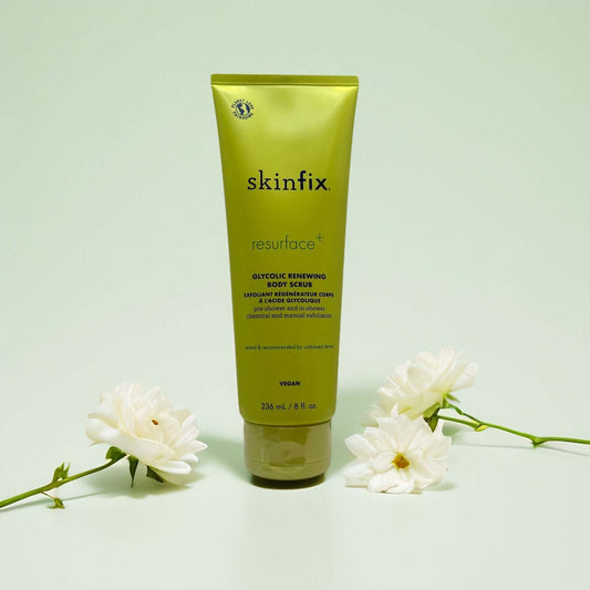 Glycolic Renewing Body Scrub by Skinfix in green tube with flowers