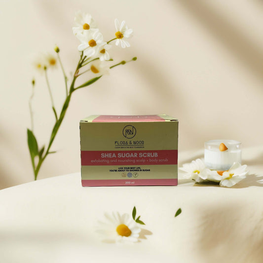 Flora & Noor Shea Sugar Scrub 200 ml packaging on display.