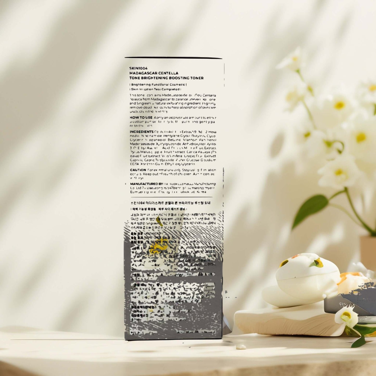 Back view of SKIN1004 Madagascar Tone Brightening Toner bottle with product details.