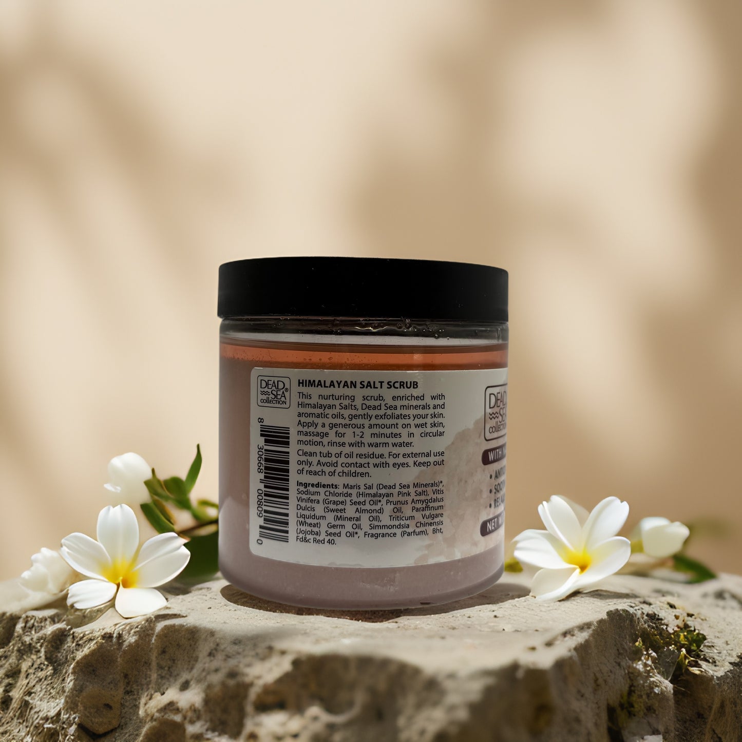 Himalayan salt scrub jar with ingredients, perfect for detoxifying and hydrating skin from Dead Sea Collection.