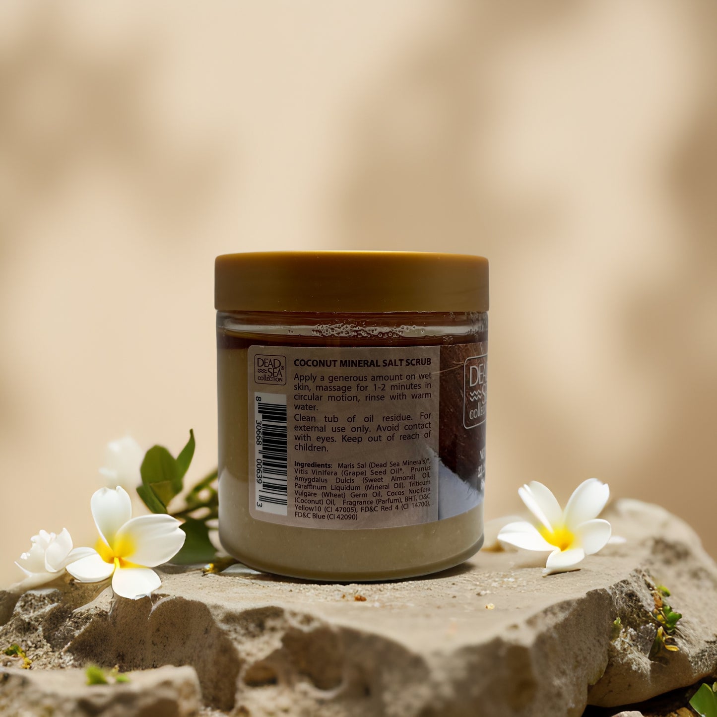 Coconut Mineral Salt Scrub jar with tropical flowers, featuring Dead Sea minerals and coconut oil for hydrating exfoliation.