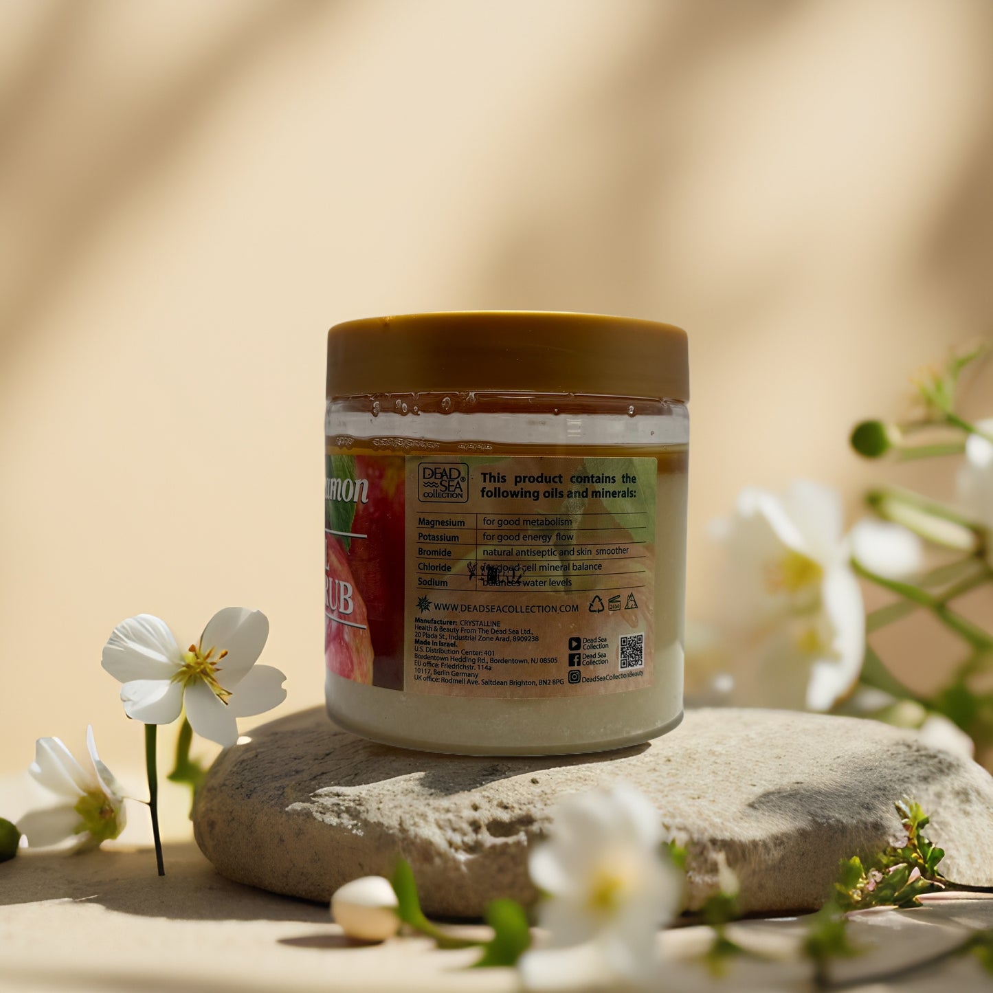 Nourishing Apple Cinnamon Mineral Salt Scrub jar with floral accents, featuring Dead Sea minerals for skin care.