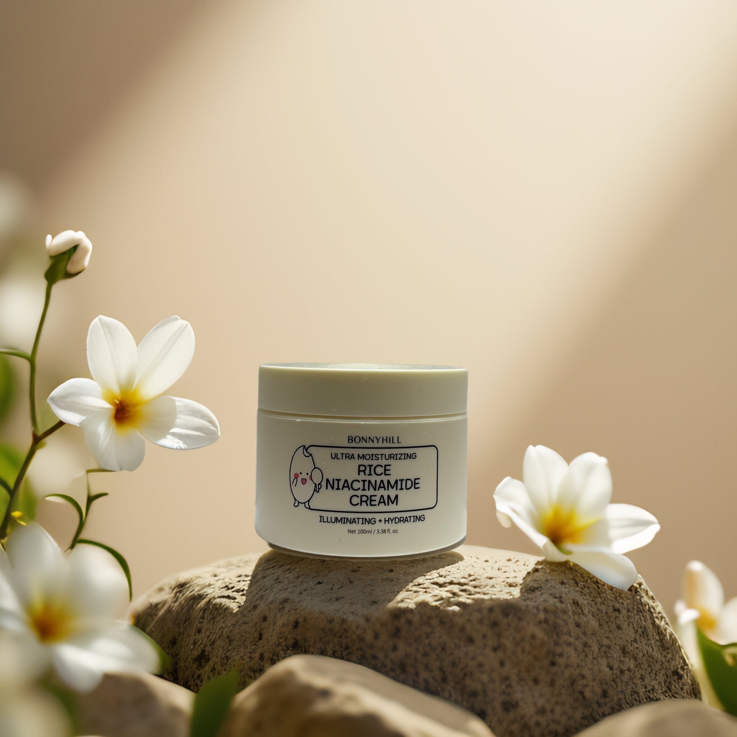 Bonnyhill Rice Niacinamide Cream on stones with flowers, illuminating and hydrating face cream for a brighter complexion.