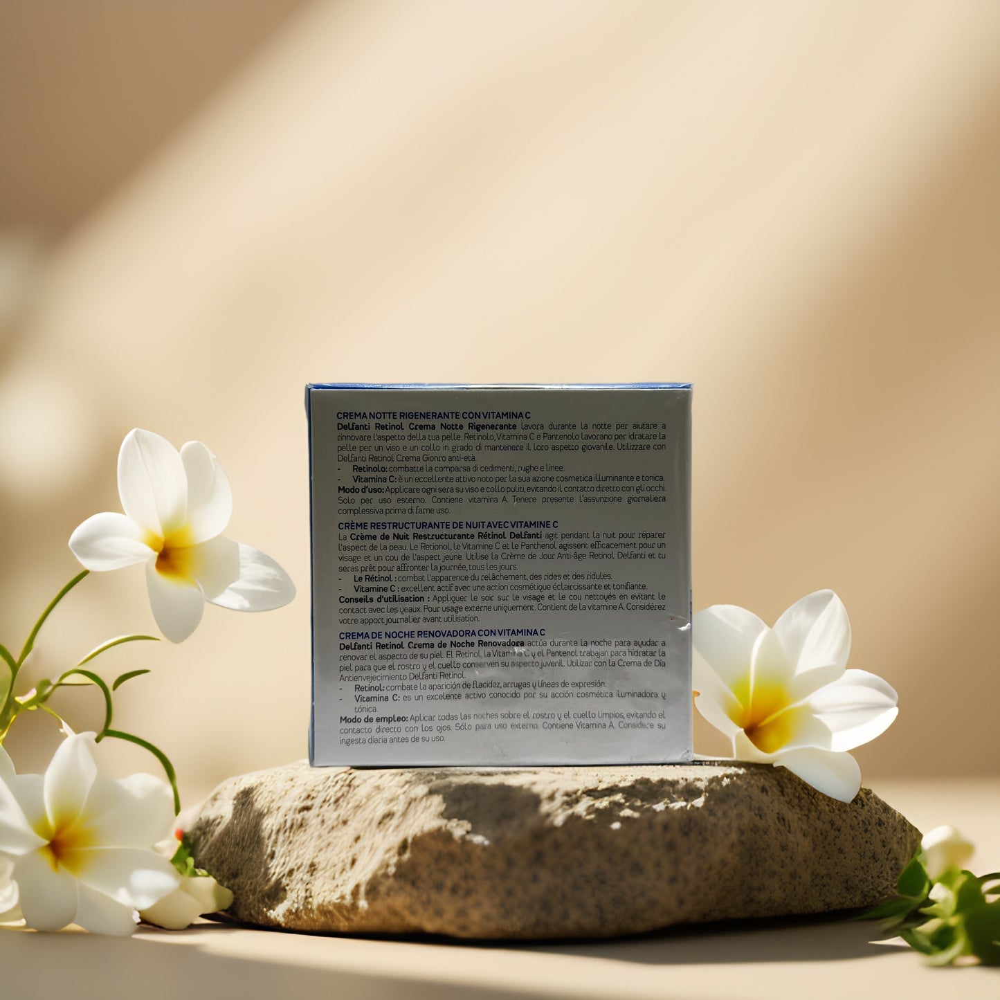Back of Delfanti Retinol Night Cream box showcasing ingredients and instructions surrounded by tropical flowers.