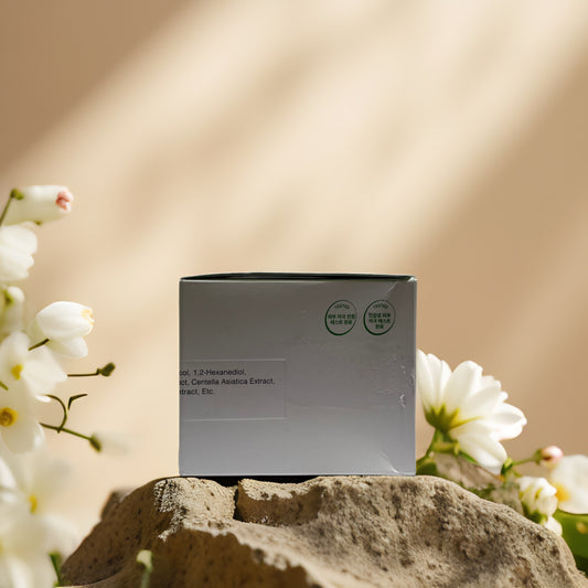 COSRX Calm & Clarify Green Calming Pad box with soft floral background, emphasizing calming ingredients.