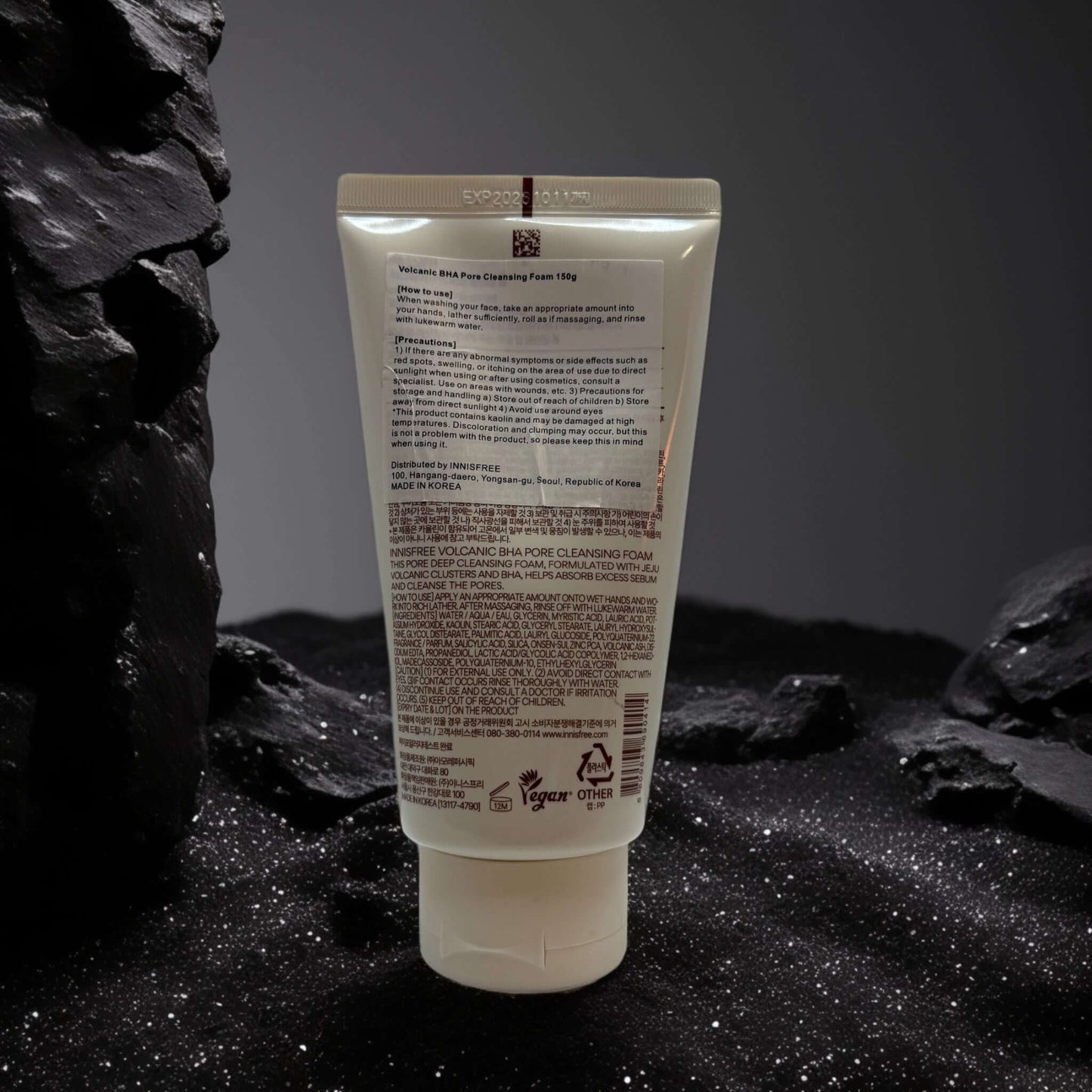 Innisfree Volcanic BHA Pore Cleansing Foam on dark background.