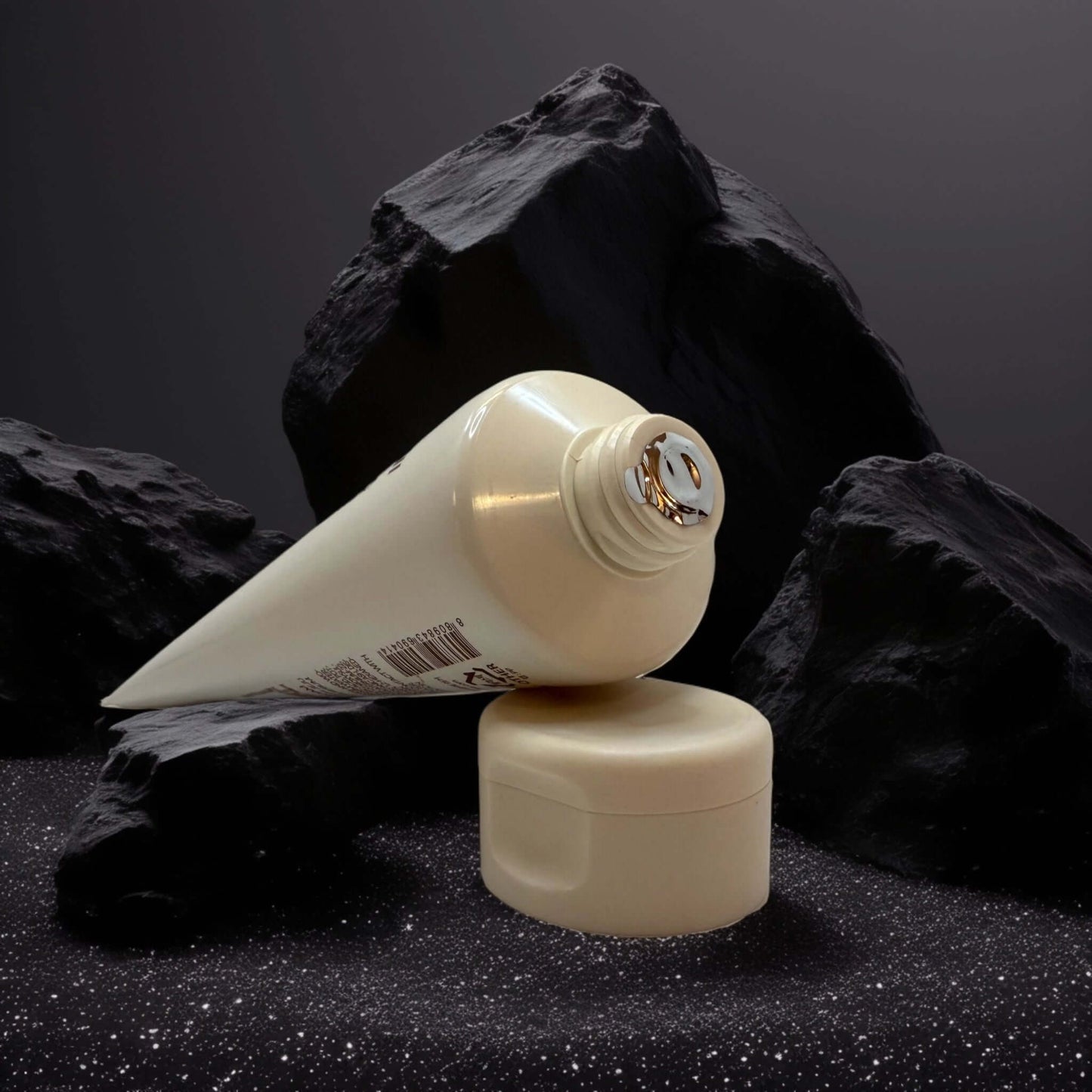 Innisfree Volcanic BHA Pore Cleansing Foam tube on dark rocks.
