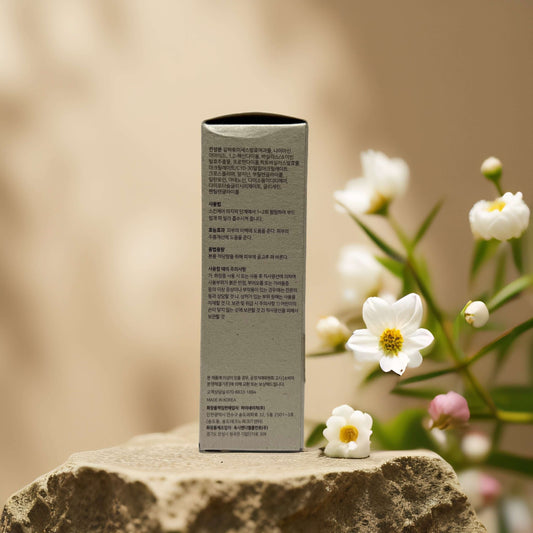 Side view of PURITO Tone-Balancing Glow Boost box with ingredients and usage directions on display.