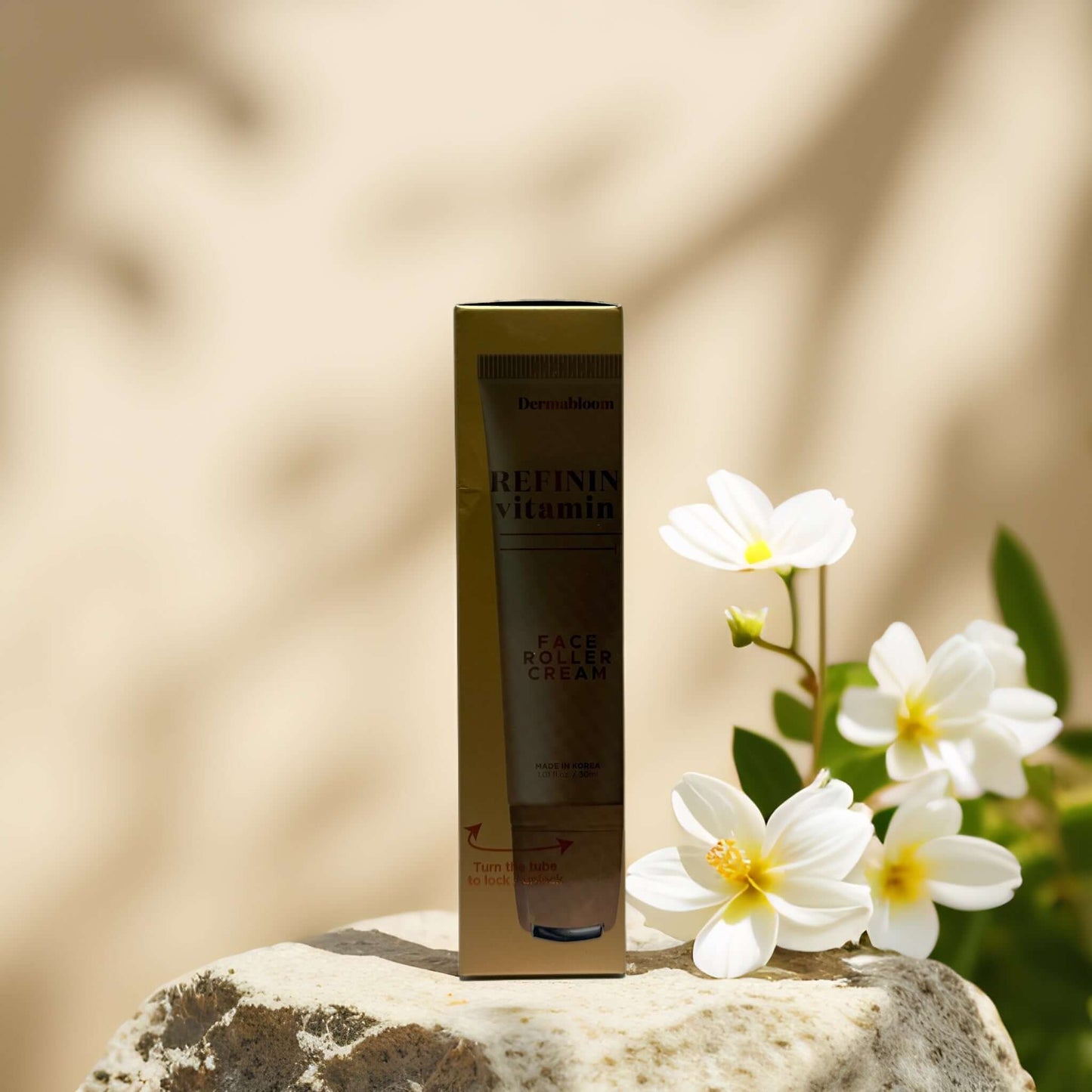 Dermabloom Retinol Vitamin Face Roller Cream packaging with flowers, promoting nourishing skincare.