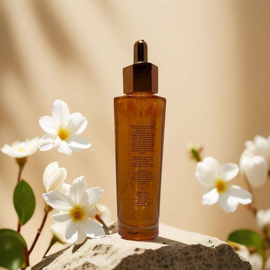 Brightening Boost Vitamin C Face Serum by Stellar Glow in a floral setting, highlighting its radiant formula.