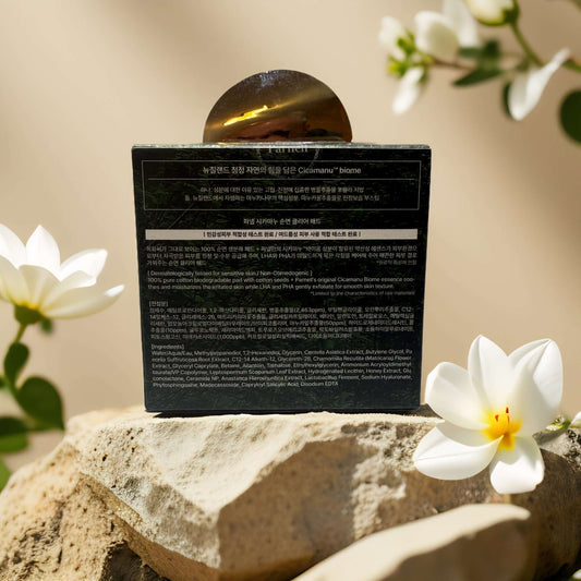 Cicamanu Cotton Clear Pad by Parnell, 5.4 fl oz, with Centella Asiatica and honey extract on a stone surface.