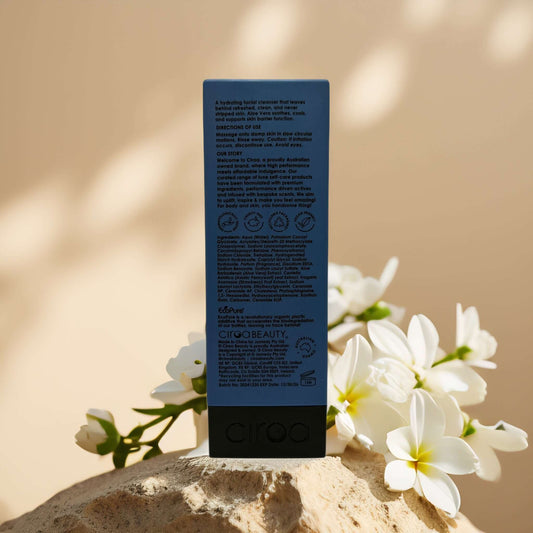 Ciroa Soothing Gel Cleanse back view with ingredient list, surrounded by white flowers on a natural backdrop.