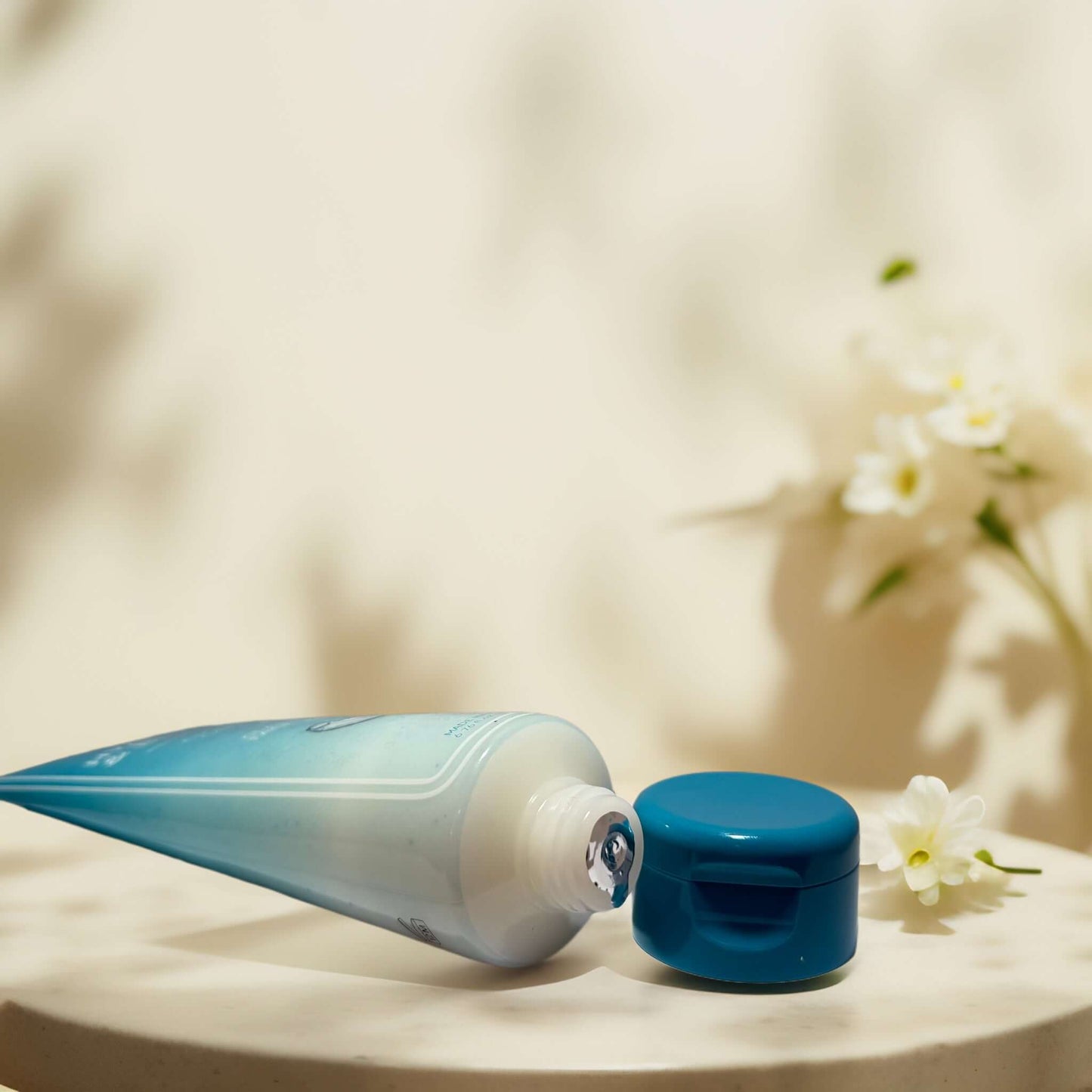 Clarify & Smooth Radiant Beauty Hyaluronic Scrub tube and cap
