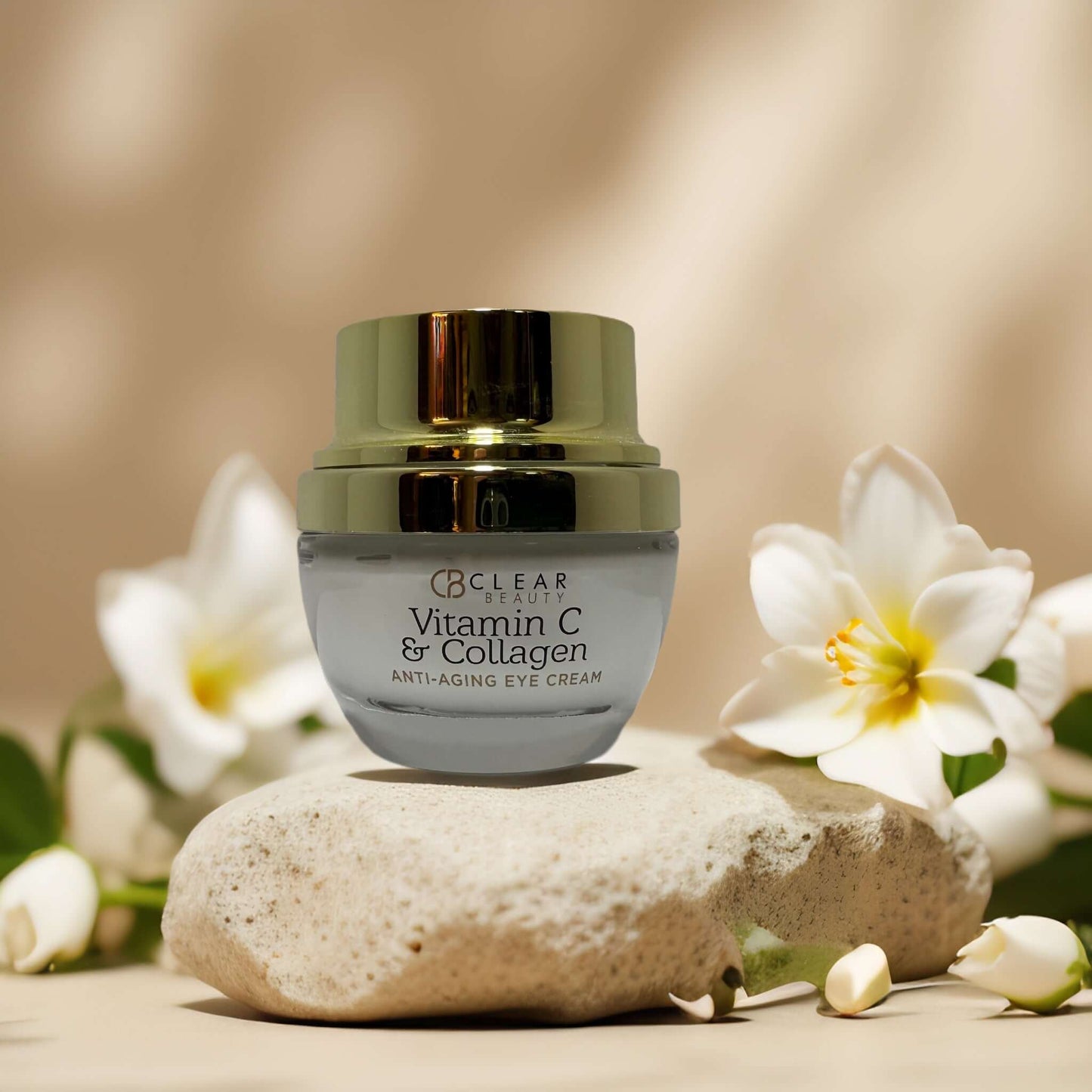 Clear Beauty Vitamin C & Collagen Anti-Aging Eye Cream on stone with flowers, targeting puffiness and dark circles.