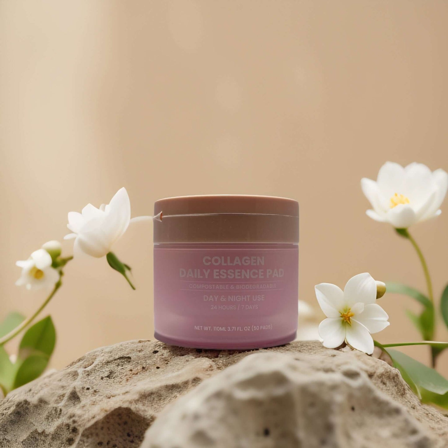 Collagen essence pads by Maske Lab in a chic container, surrounded by white flowers, promoting hydration and skin firmness.