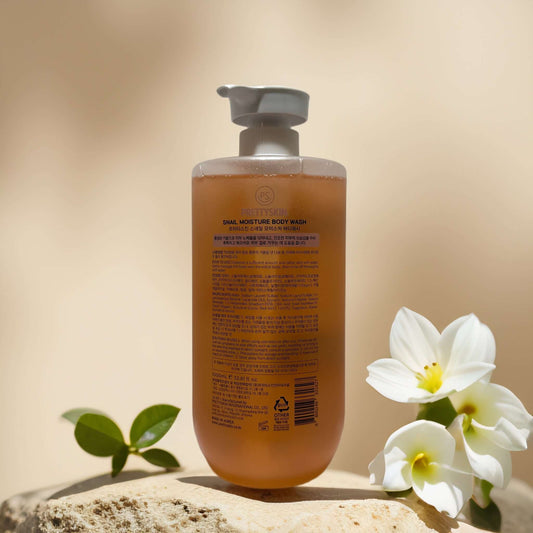 Deep Moisture Cleanse Snail Moisture Body Wash by PRETTYSKIN in 33.8 fl oz bottle with white flowers.