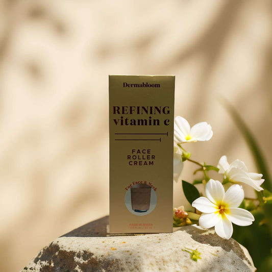 Dermabloom Refining Vitamin E Face Roller Cream box with flowers, promoting skin radiance and nourishment.