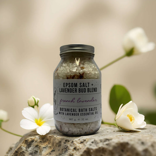 Epsom salt and lavender bud blend in a jar, featuring botanical bath salts for relaxation and soothing bath time.