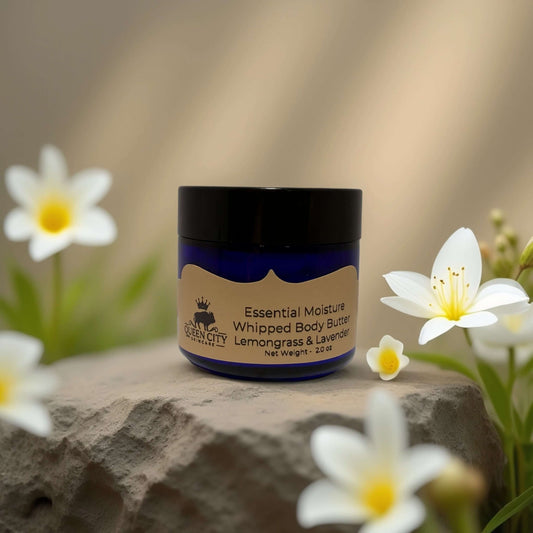 POS Lemongrass & Lavender Whipped Body Butter by QCS Essential Moisture in blue jar with flowers.