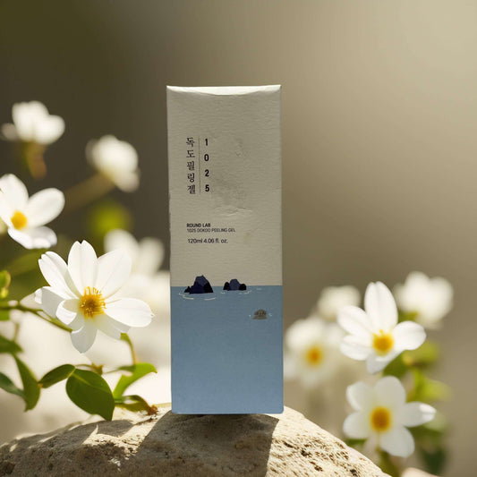 1025 Dokdo Peeling Gel by Round Lab packaging, gentle exfoliating gel with floral background, 4.1 fl oz.