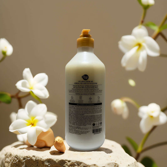 Gently Nourish Original Goat Milk Body Wash in 27.1 oz bottle with floral accents, ideal for gentle skincare.