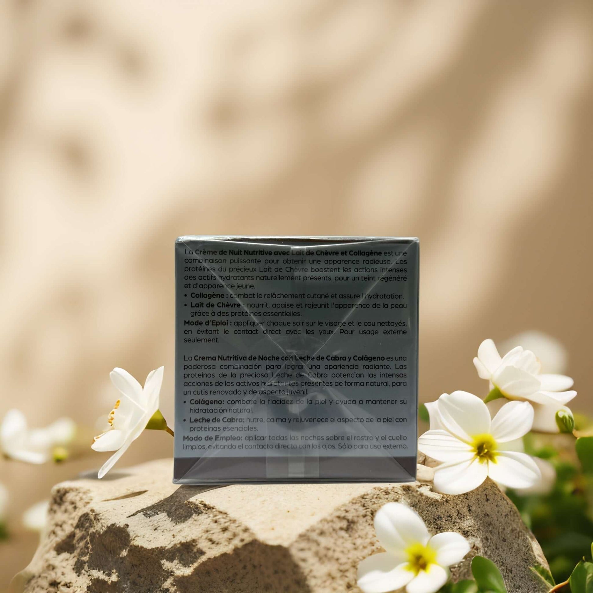 Nourish & Regenerate Goat’s Milk Night Cream box on a stone with white flowers, highlighting collagen and moisturizing benefits.