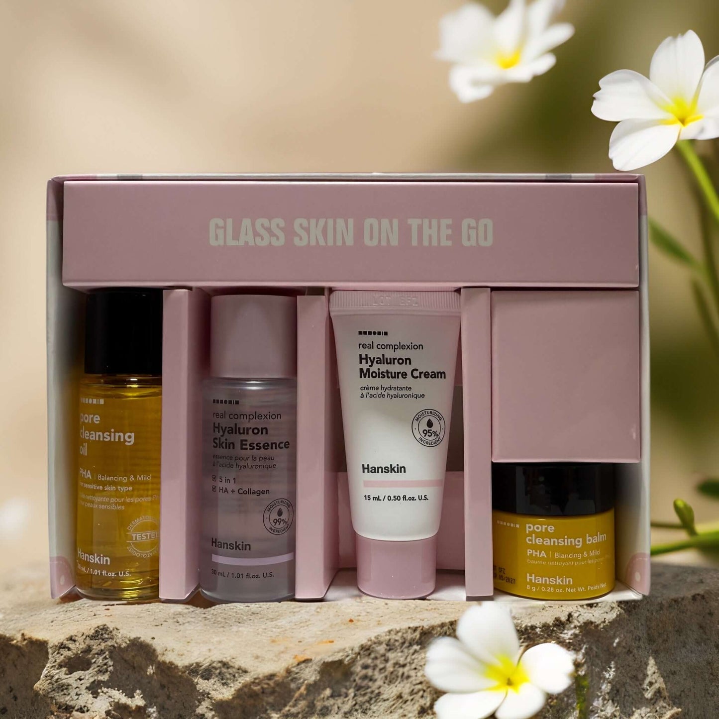 4-step Hanskin skincare kit for glass skin, including cleanser, essence, moisturizer, and toner in travel size.
