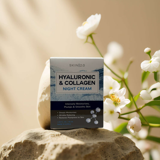 Hyaluronic & Collagen Night Cream by Skin 2.0 on a stone surface with flowers, promotes hydration and plump skin.
