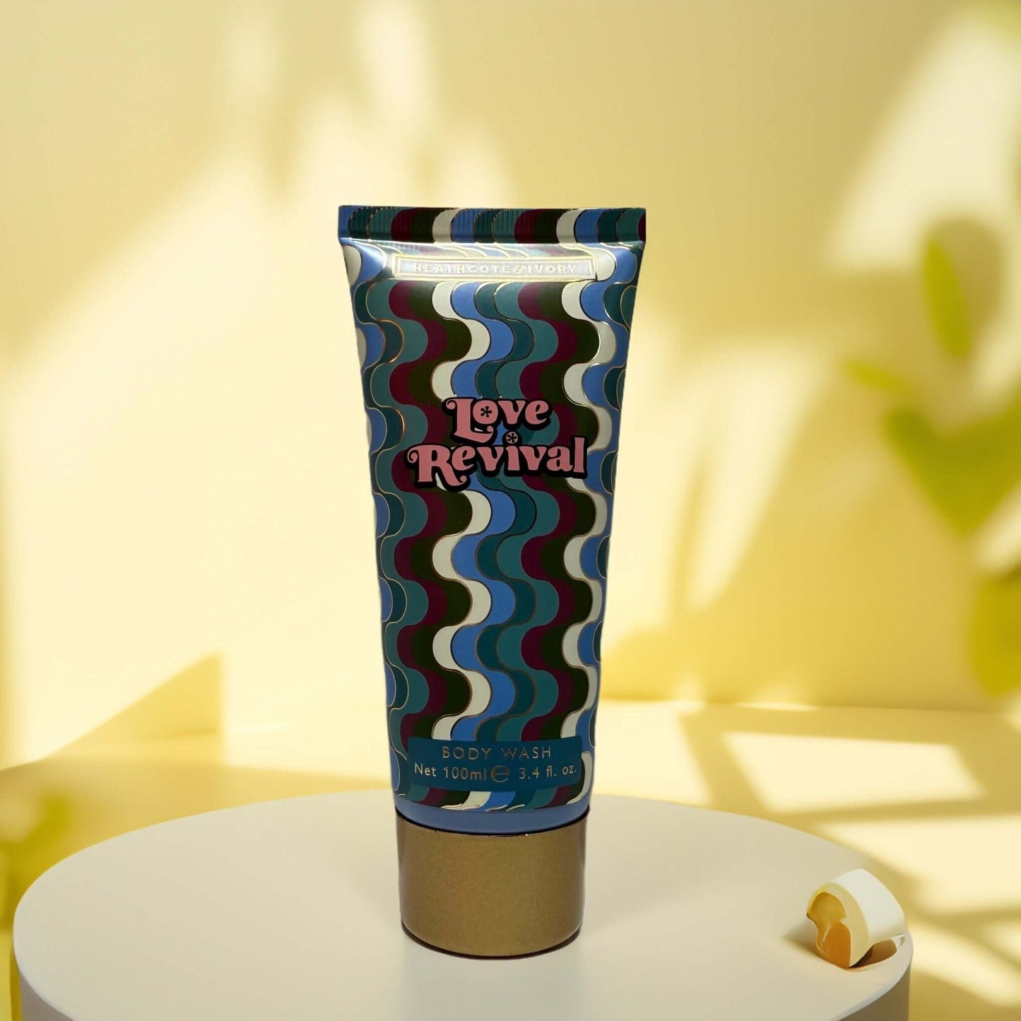 Love Revival Body Wash tube with vibrant design, 3.4 fl oz.