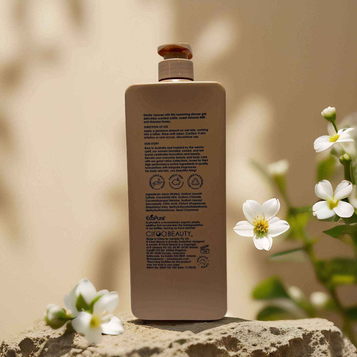 Back view of Ciroa Hydrate & Rejuvenate Ashwagandha + Walnut Oil Shower Gel bottle with floral accents.