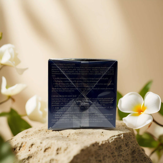 Hydrating Overnight Repair night cream box by Delfanti on a stone surface with floral accents.