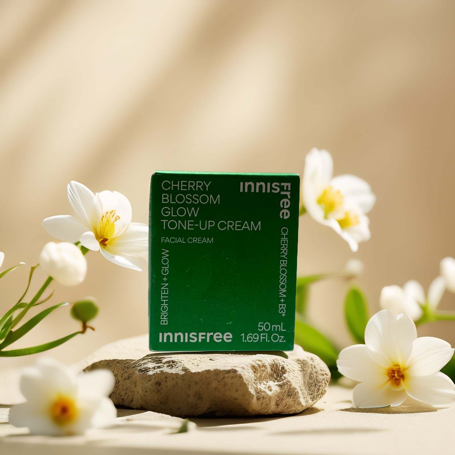Innisfree Cherry Blossom Glow Tone-Up Cream 50ml with floral background, promoting bright and radiant skin.