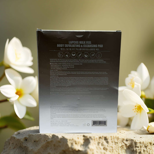 Back of LAPCOS Milk Feel Exfoliating Pads packaging with product details and floral background.