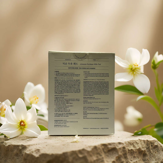 Back view of Mixsoon Gentle Exfoliation Soybean Milk Pad packaging with floral background.