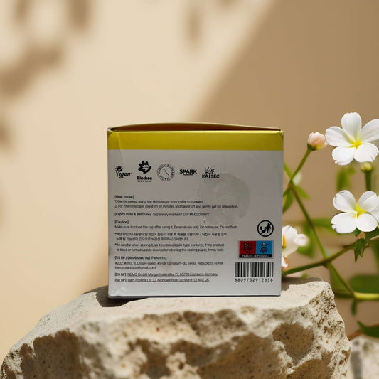 Back view of mixsoon Bean Toner Pads jar showing product details and certifications against a natural background.