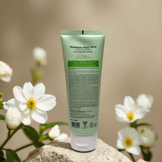 Moisture Aloe Vera Cleansing Foam by GLAMFOX, 5.3 fl oz tube back view with white flowers.