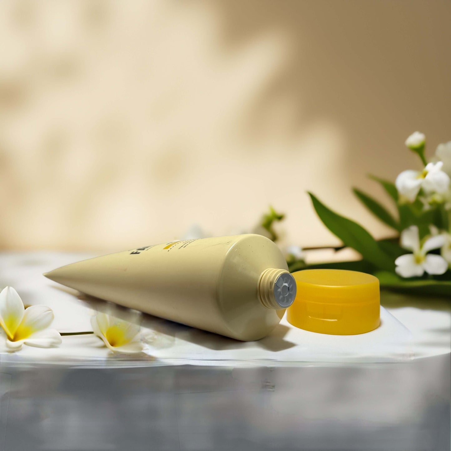 Moisturizing daily cleanse honey face wash tube with yellow cap and white flowers, ideal for dry and sensitive skin.