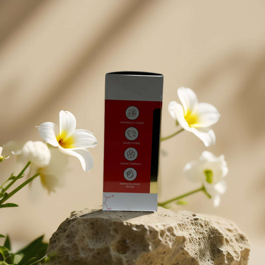 Bella Beauty Brightening + Firming Under Eye Roller Serum packaging with floral backdrop, highlighting clean, cruelty-free, vegan attributes.