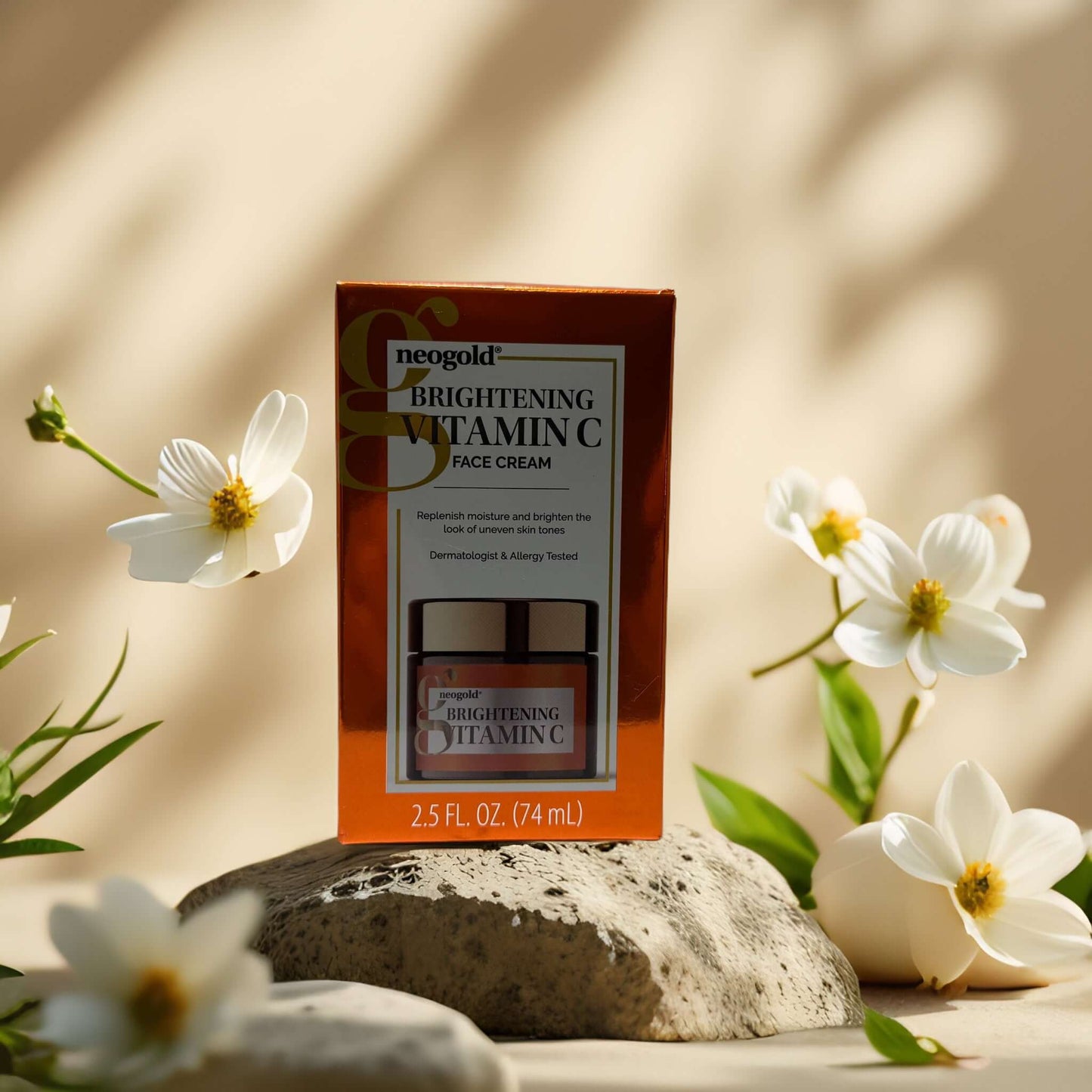 Neogold Brightening Vitamin C Face Cream packaging with flowers, 2.5 fl oz for skin brightening and tone repair.