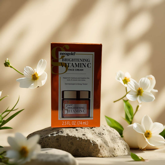 Neogold Brightening Vitamin C Face Cream packaging with flowers, 2.5 fl oz for skin brightening and tone repair.