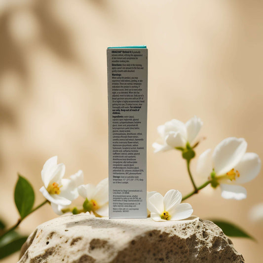Obagi Medical Retinol 0.5 Cream packaging with ingredients and usage instructions against a floral background.