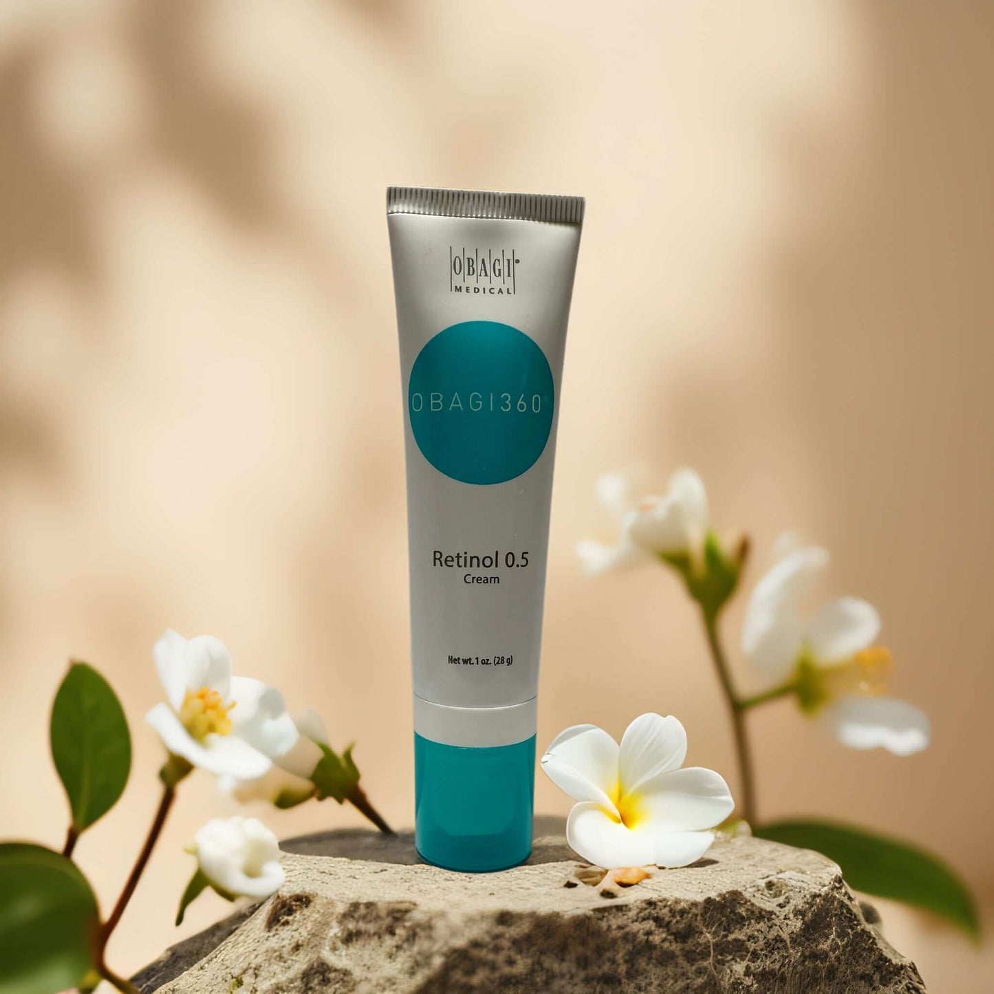 Obagi Medical Retinol 0.5 Cream tube with flowers, designed to reduce aging signs and improve skin texture.