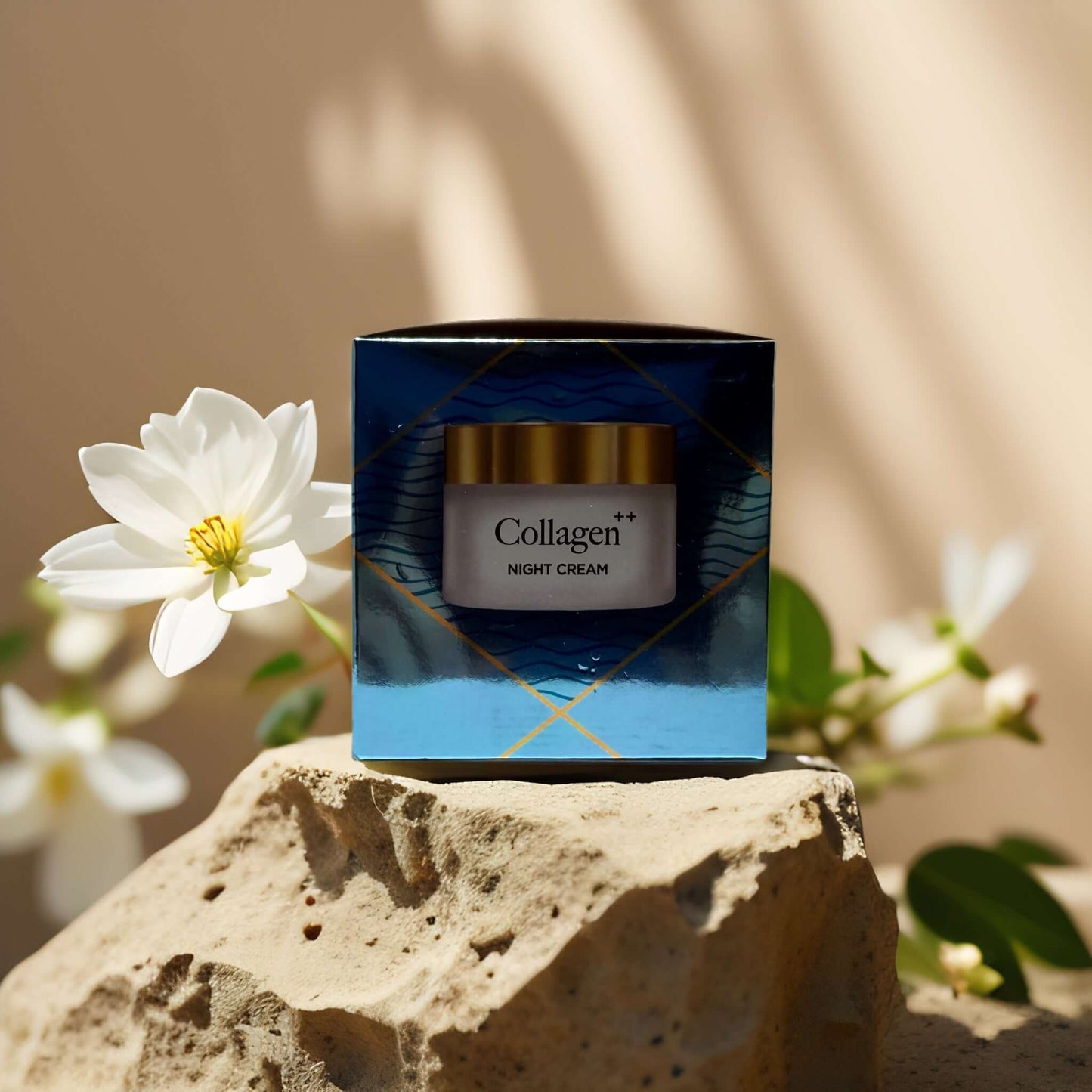 Collagen++ Age-Defying Night Cream in blue packaging with flowers in background, promotes firm and hydrated skin.