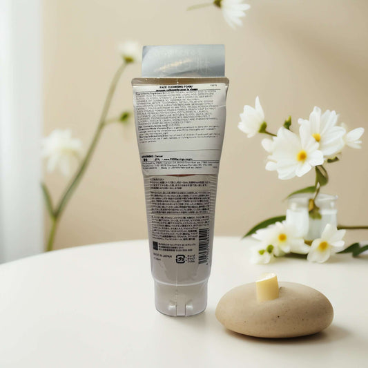 Momo Puri Peach Ceramide Cleansing Wash tube on a table.