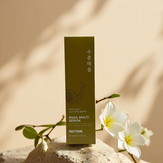 PRETTYSKIN Snail Multi Serum package with flowers, promoting deep hydration and skin repair for all skin types.