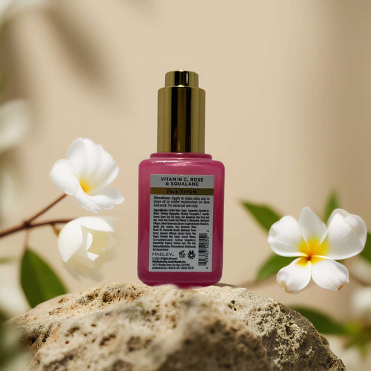 Findley Radiance Support Vitamin C, Rose & Squalane Serum in 2.0 fl oz with floral background.