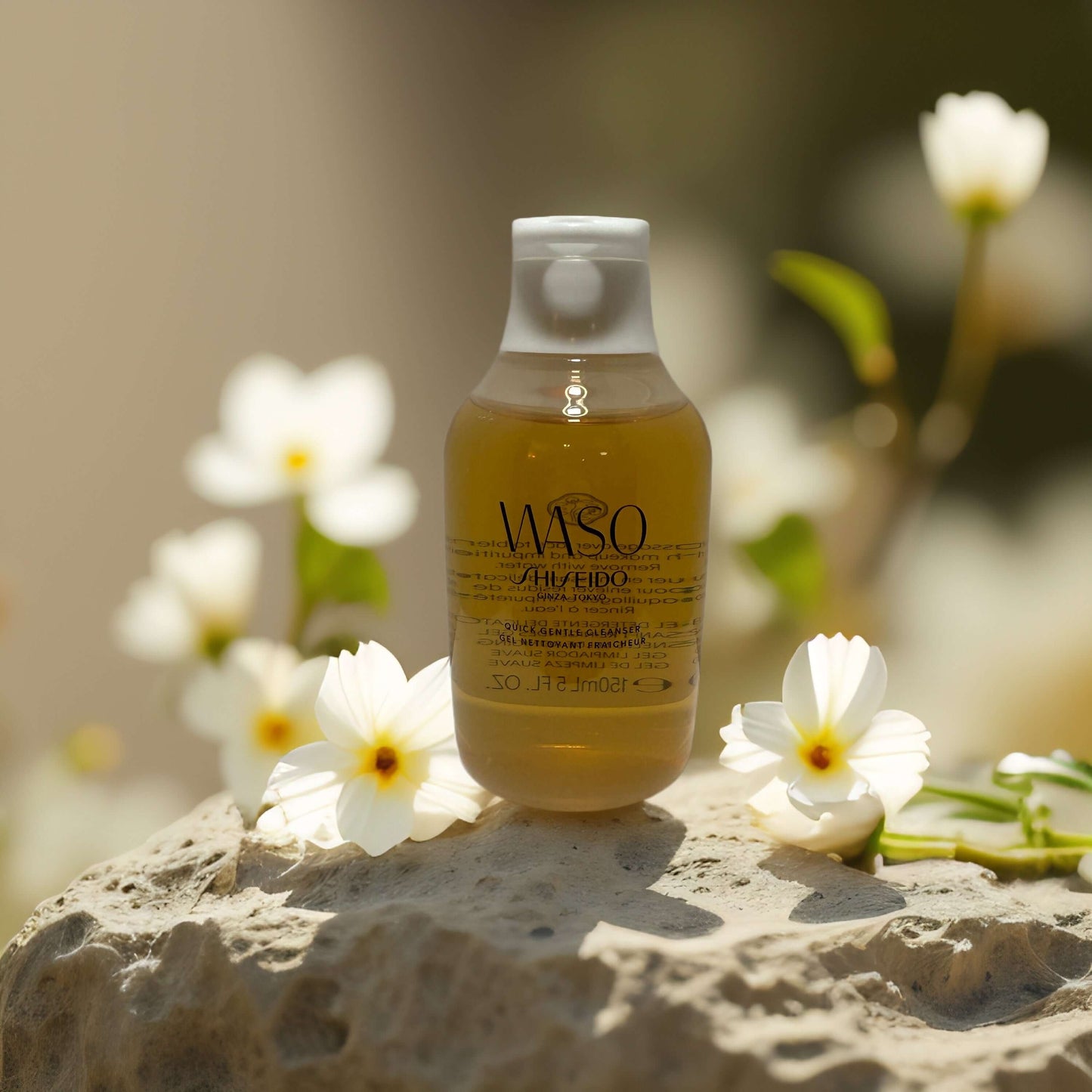 Gentle Daily Cleanse by Shiseido WASO in a floral setting, showcasing lightweight gel cleanser for sensitive skin.