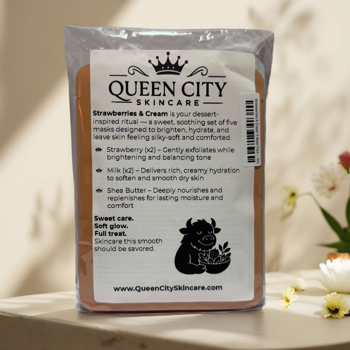 Packaging of Queen City Skincare's Strawberries & Cream sheet mask, infused with strawberry and milk for hydration.